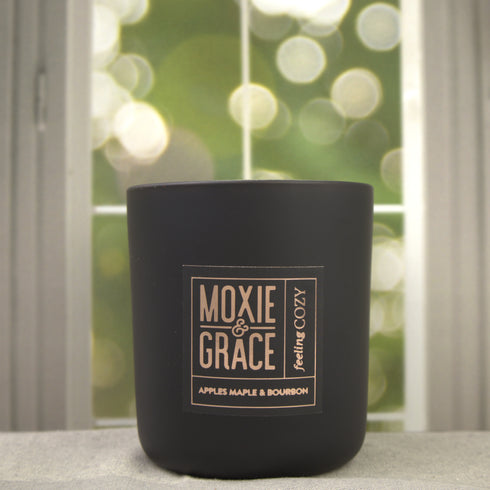 Apples Maple & Bourbon 12oz Candle in Black by Moxie & Grace — a cozy harvest blend of apple, maple, bourbon, cinnamon, and vanilla