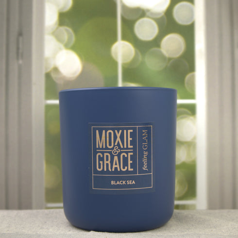 Sweet Tobacco 12oz Candle in Navy by Moxie & Grace — a rich, warm blend of tobacco, vanilla, honey, amber, and dark musk