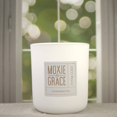 Chamomile Tea 12oz Candle in White by Moxie & Grace — a calming blend of chamomile, honey, vanilla, and soft musk