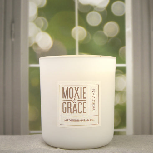 Mediterranean Fig 12oz Candle in White by Moxie & Grace — a lush, earthy blend of fig, green leaves, cedar, and warm musk
