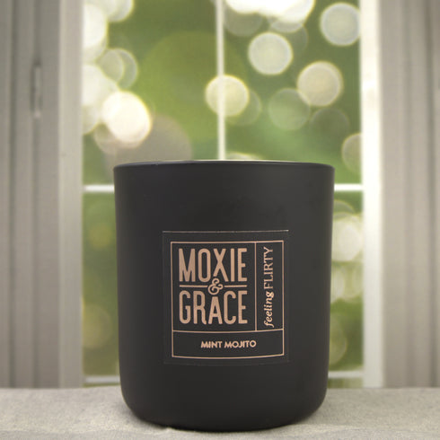 Mint Mojito 12oz Candle in Black by Moxie & Grace — a crisp, refreshing blend of spearmint, lime, sugarcane, and fresh herbs
