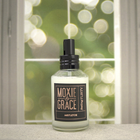 Mistletoe Room Spray 4oz bottle by Moxie & Grace — fresh eucalyptus, pine, fir, clove, and cedarwood fragrance, non-toxic and USA-made