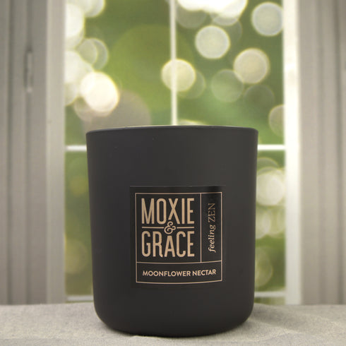 Moonflower Nectar 12oz Candle in Black by Moxie & Grace — an enchanting blend of pear, agave, marine florals, dark musk, and amber