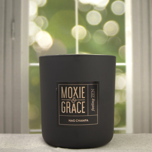 Nag Champa 12oz Candle in Black by Moxie & Grace — a meditative blend of sandalwood, patchouli, amber, rose, and dark musk