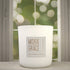 Red Ginger & Saffron 12oz Candle in White by Moxie & Grace — a vibrant blend of ginger, saffron, lemon, amber, patchouli, and cedarwood
