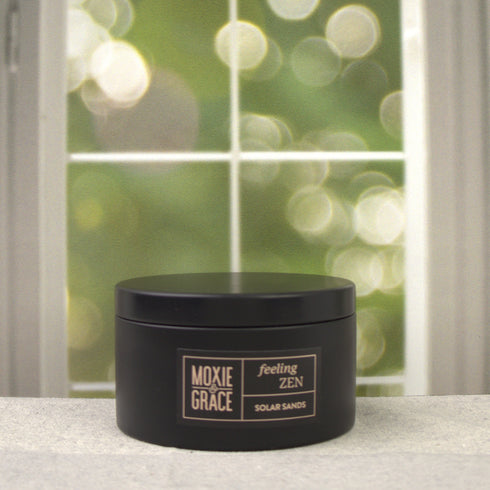 Solar Sands 5oz Candle in Black by Moxie & Grace — a warm, sun-drenched blend of sand, amber, musk, and golden citrus notes