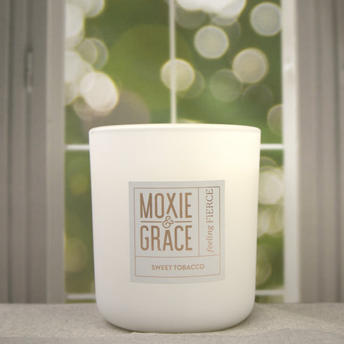 Sweet Tobacco 12oz Candle in White by Moxie & Grace — a rich, warm blend of tobacco, vanilla, honey, amber, and dark musk