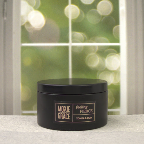 Tonka & Oud 5oz Candle in Black by Moxie & Grace — a luxurious blend of oud, tonka bean, sandalwood, amber, and dark musk