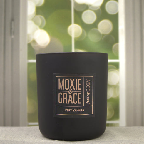 Very Vanilla 12oz Candle in Black by Moxie & Grace — a rich, warm blend of vanilla bean, tonka, caramel, and soft musk