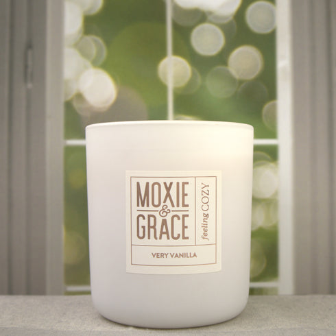 Very Vanilla 12oz Candle in White by Moxie & Grace — a rich, warm blend of vanilla bean, tonka, caramel, and soft musk